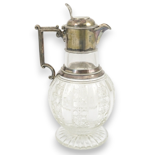 31 - A late Victorian silver mounted cut glass claret jug, by Edward Hutton, with angular handle and hobn... 