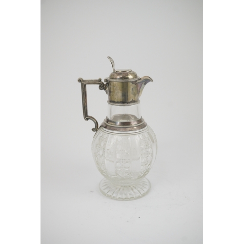 31 - A late Victorian silver mounted cut glass claret jug, by Edward Hutton, with angular handle and hobn... 