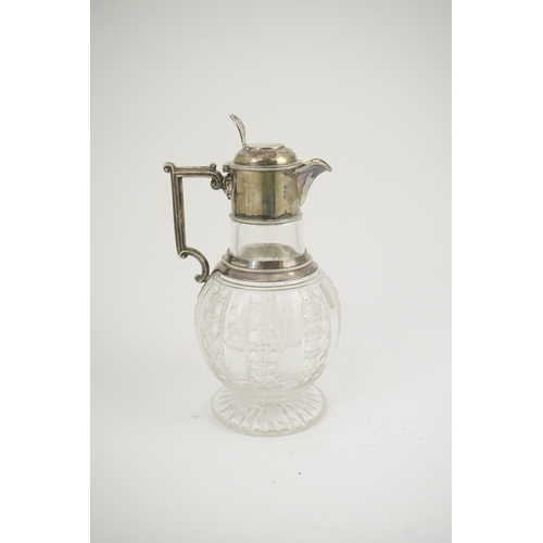 31 - A late Victorian silver mounted cut glass claret jug, by Edward Hutton, with angular handle and hobn... 