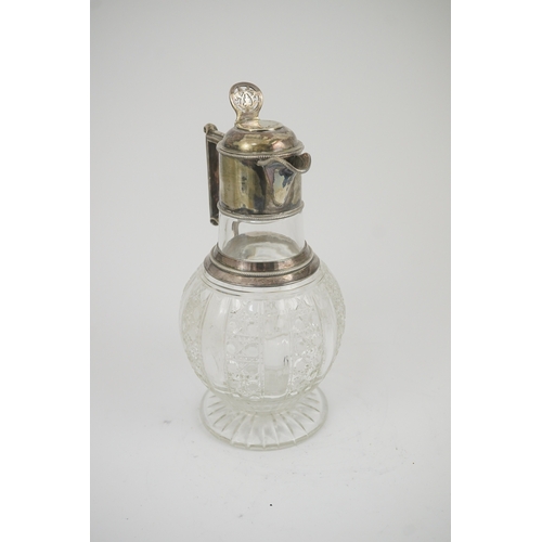 31 - A late Victorian silver mounted cut glass claret jug, by Edward Hutton, with angular handle and hobn... 