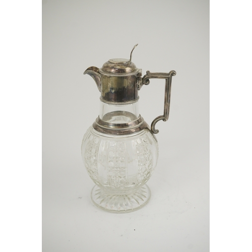 31 - A late Victorian silver mounted cut glass claret jug, by Edward Hutton, with angular handle and hobn... 