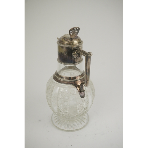 31 - A late Victorian silver mounted cut glass claret jug, by Edward Hutton, with angular handle and hobn... 