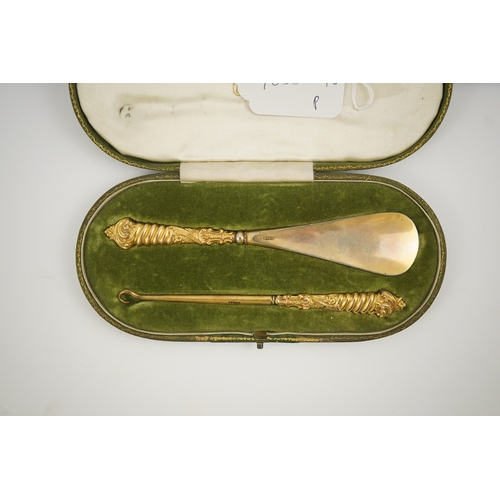 34 - A cased late Victorian 9ct gold handled shoe horn and button hook set, makers, M & A, Birmingham, 18... 