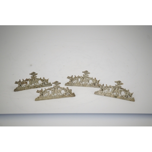 35 - A set of four Edwardian pierced silver 'hunting scene' menu holders, by Stuart Clifford, London, 190... 