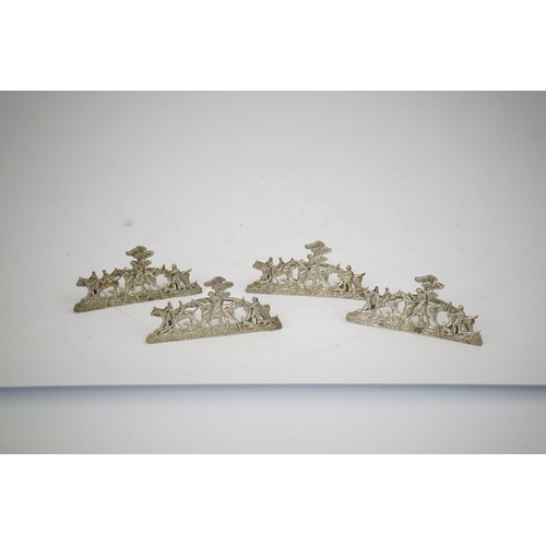 35 - A set of four Edwardian pierced silver 'hunting scene' menu holders, by Stuart Clifford, London, 190... 