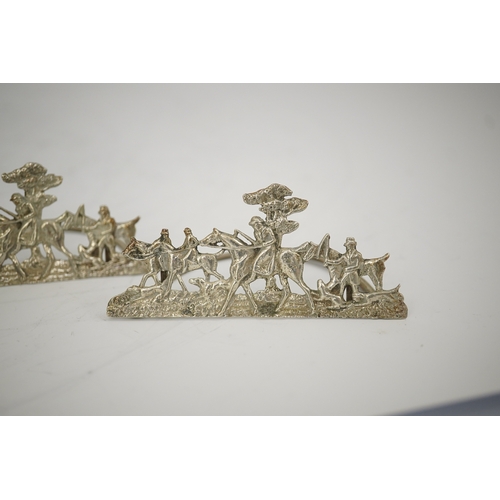 35 - A set of four Edwardian pierced silver 'hunting scene' menu holders, by Stuart Clifford, London, 190... 