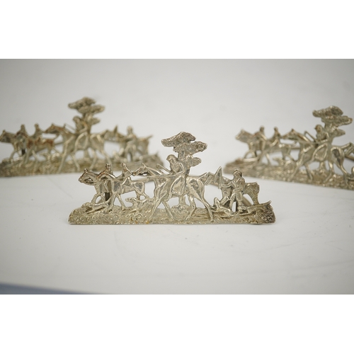 35 - A set of four Edwardian pierced silver 'hunting scene' menu holders, by Stuart Clifford, London, 190... 