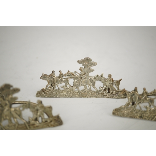 35 - A set of four Edwardian pierced silver 'hunting scene' menu holders, by Stuart Clifford, London, 190... 