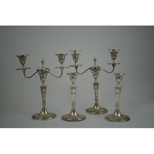 37 - A pair of Edwardian silver two branch, two light candelabra, by Walker & Hall and a pair of matching... 