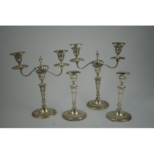 37 - A pair of Edwardian silver two branch, two light candelabra, by Walker & Hall and a pair of matching... 