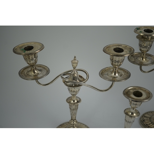 37 - A pair of Edwardian silver two branch, two light candelabra, by Walker & Hall and a pair of matching... 