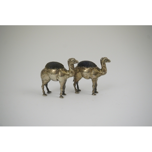 43 - A pair of Edwardian novelty silver pin cushions, each modelled as a camel, by Adie & Lovekin Ltd, Bi... 