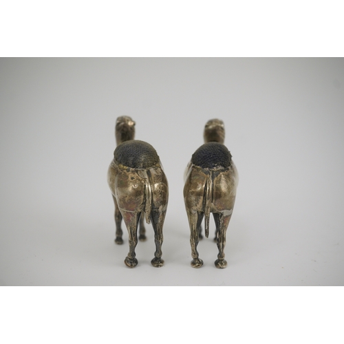 43 - A pair of Edwardian novelty silver pin cushions, each modelled as a camel, by Adie & Lovekin Ltd, Bi... 