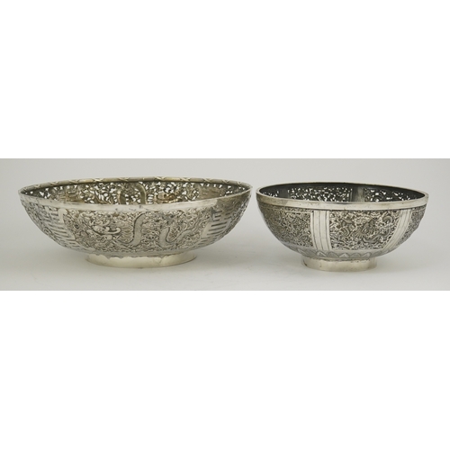 45 - Two early 20th century Chinese Export pierced silver circular bowls, decorated with dragons and chry... 