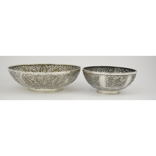 45 - Two early 20th century Chinese Export pierced silver circular bowls, decorated with dragons and chry... 