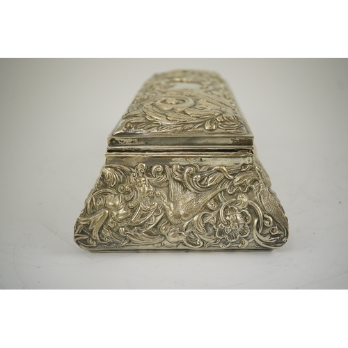 46 - An Edwardian repousse silver mounted jewellery casket, by William Comyns, of sarcophagus form and de... 