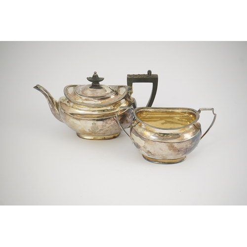 47 - An Edwardian silver teapot and a matching sugar bowl, with engraved inscription, relating to the Roy... 