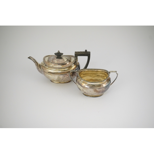 47 - An Edwardian silver teapot and a matching sugar bowl, with engraved inscription, relating to the Roy... 