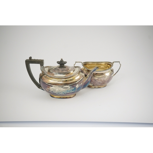 47 - An Edwardian silver teapot and a matching sugar bowl, with engraved inscription, relating to the Roy... 