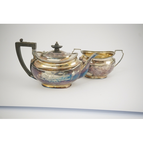 47 - An Edwardian silver teapot and a matching sugar bowl, with engraved inscription, relating to the Roy... 