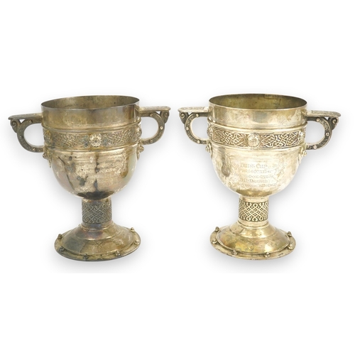 52 - A pair of late Victorian Arts & Crafts Celtic style silver two handled presentation pedestal trophy ... 