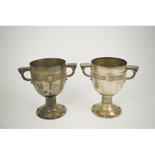 52 - A pair of late Victorian Arts & Crafts Celtic style silver two handled presentation pedestal trophy ... 