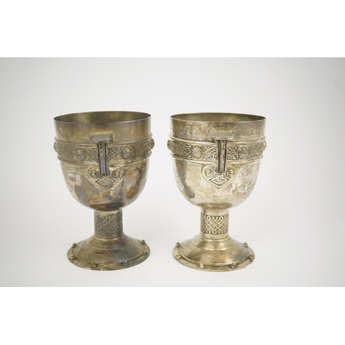 52 - A pair of late Victorian Arts & Crafts Celtic style silver two handled presentation pedestal trophy ... 