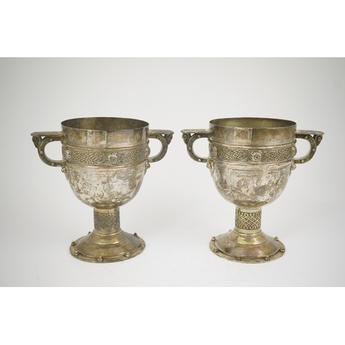 52 - A pair of late Victorian Arts & Crafts Celtic style silver two handled presentation pedestal trophy ... 