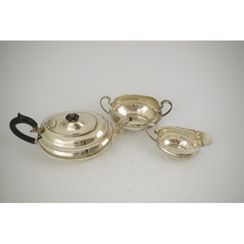 58 - A George V silver three piece oval tea set, by Viners Ltd, with engraved band, Sheffield, 1933, gros... 