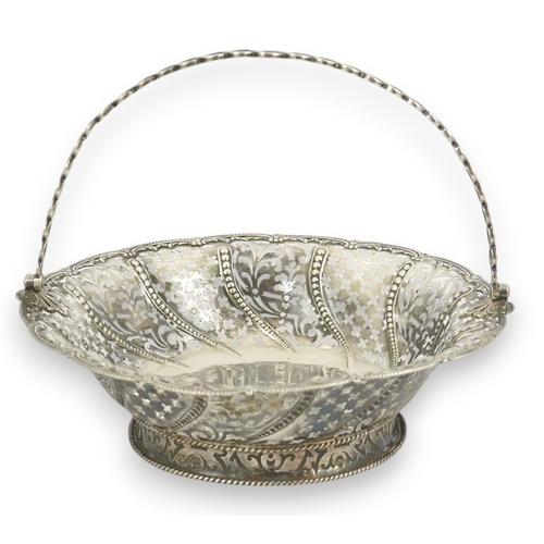 6 - A late George II pierced silver cake basket, by William Plummer?, of shaped circular form, with engr... 