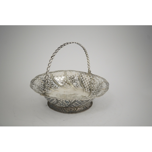 6 - A late George II pierced silver cake basket, by William Plummer?, of shaped circular form, with engr... 