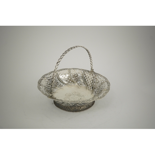 6 - A late George II pierced silver cake basket, by William Plummer?, of shaped circular form, with engr... 