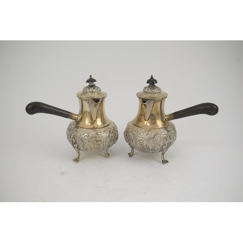 64 - A pair of George V silver chocolate pots, by Goldsmiths & Silversmiths Co Ltd, of baluster form and ... 