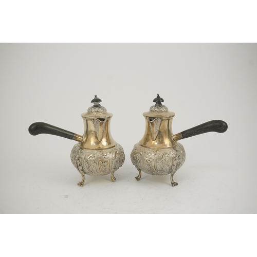 64 - A pair of George V silver chocolate pots, by Goldsmiths & Silversmiths Co Ltd, of baluster form and ... 