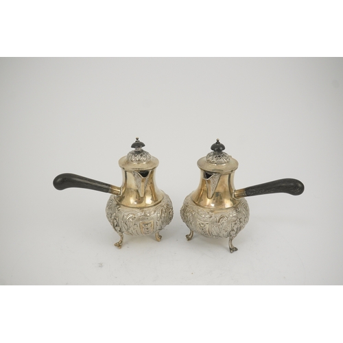 64 - A pair of George V silver chocolate pots, by Goldsmiths & Silversmiths Co Ltd, of baluster form and ... 