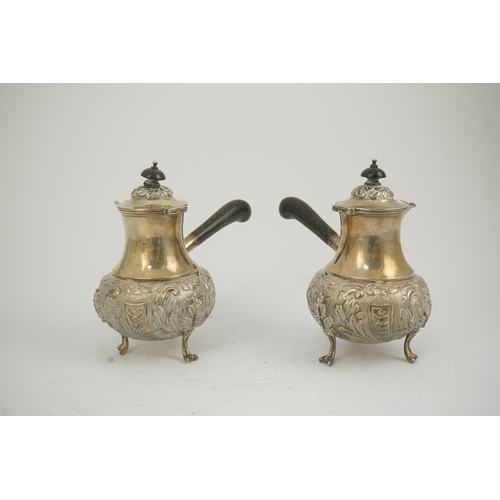 64 - A pair of George V silver chocolate pots, by Goldsmiths & Silversmiths Co Ltd, of baluster form and ... 