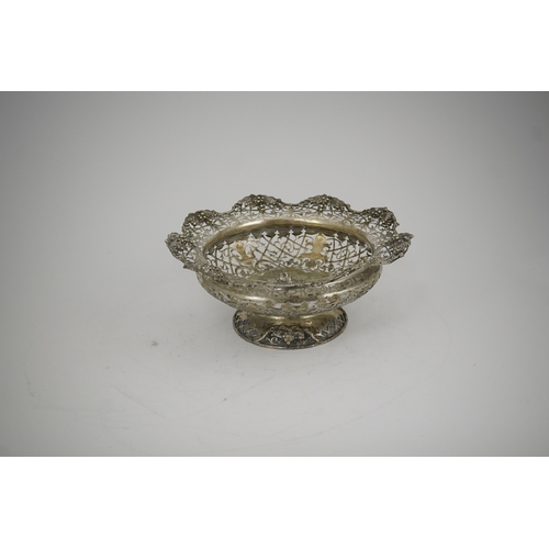 66 - A George V pierced silver circular pedestal bowl, by Mappin & Webb, with scroll decoration and fruit... 