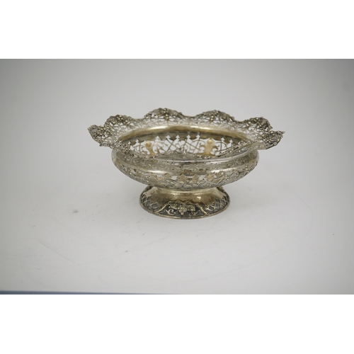 66 - A George V pierced silver circular pedestal bowl, by Mappin & Webb, with scroll decoration and fruit... 