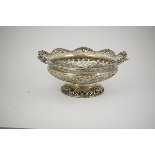 66 - A George V pierced silver circular pedestal bowl, by Mappin & Webb, with scroll decoration and fruit... 