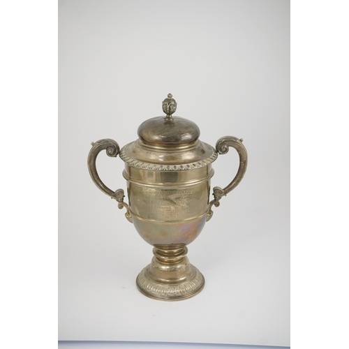 71 - A George V silver two handled presentation trophy cup and cover by Hunt & Roskell Ltd (late Storr & ... 