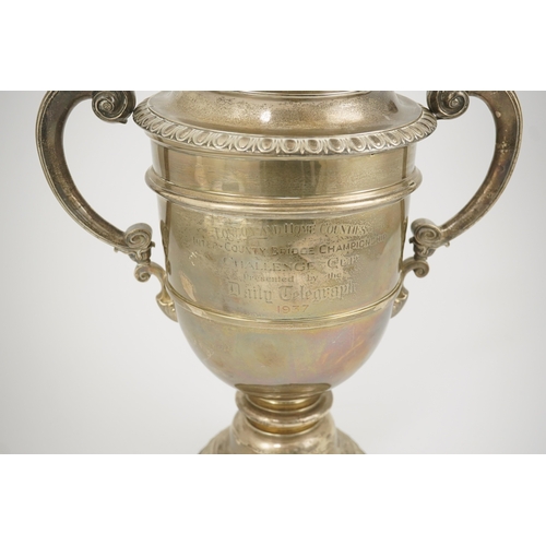 71 - A George V silver two handled presentation trophy cup and cover by Hunt & Roskell Ltd (late Storr & ... 