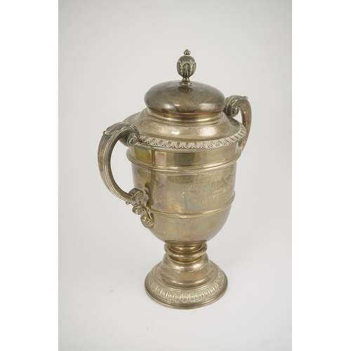 71 - A George V silver two handled presentation trophy cup and cover by Hunt & Roskell Ltd (late Storr & ... 