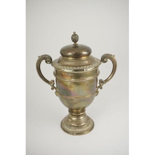 71 - A George V silver two handled presentation trophy cup and cover by Hunt & Roskell Ltd (late Storr & ... 