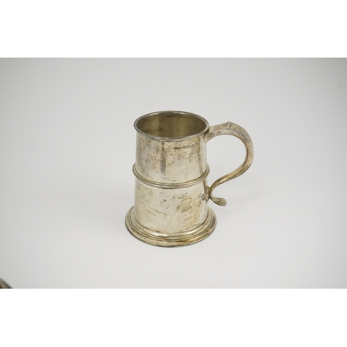 75 - A George V silver mug, by William Hair Haseler Ltd, with banded girdle and S scroll handle, Birmingh... 