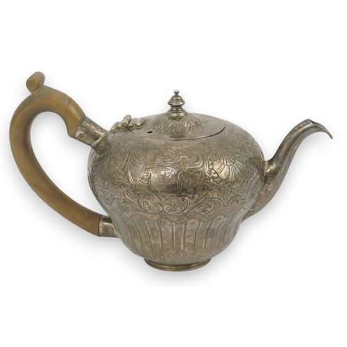 8 - An 18th century Irish silver inverted pyriform bachelor's teapot, maker E.R, embossed with shell, ge... 