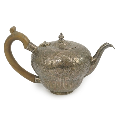 8 - An 18th century Irish silver inverted pyriform bachelor's teapot, maker E.R, embossed with shell, ge... 