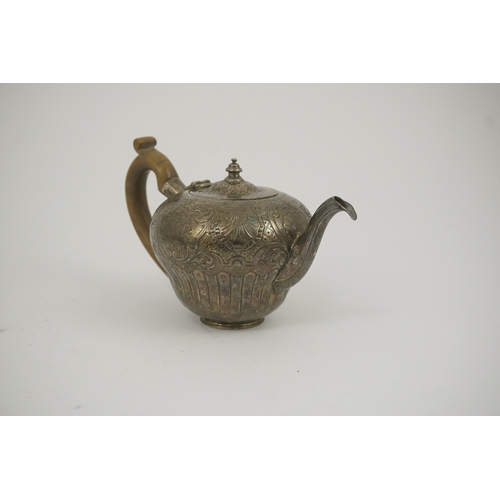 8 - An 18th century Irish silver inverted pyriform bachelor's teapot, maker E.R, embossed with shell, ge... 