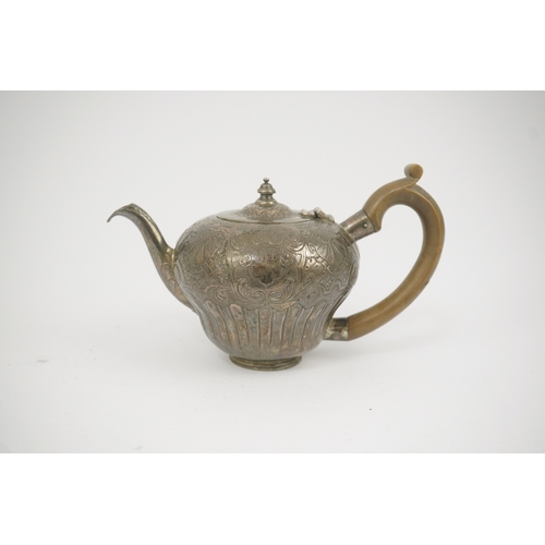 8 - An 18th century Irish silver inverted pyriform bachelor's teapot, maker E.R, embossed with shell, ge... 