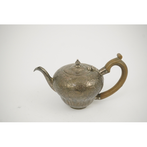 8 - An 18th century Irish silver inverted pyriform bachelor's teapot, maker E.R, embossed with shell, ge... 