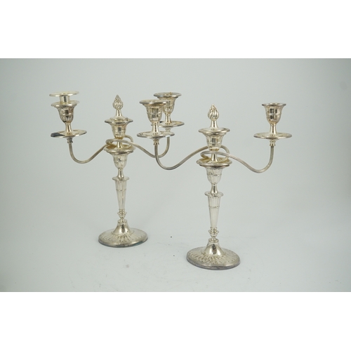 86 - A modern pair of silver two branch three light oval candelabra, by James Dixon and Sons Ltd, with re... 